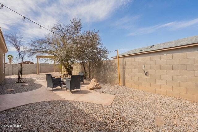 view of yard featuring a patio area and a fenced backyard