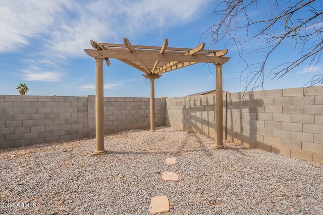 view of yard with a pergola and a fenced backyard