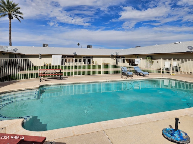 view of swimming pool with a patio