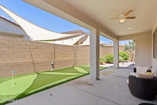 view of patio featuring ceiling fan