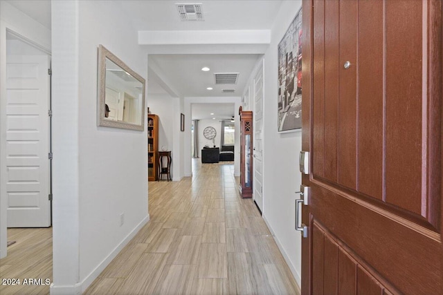 hall with light hardwood / wood-style flooring