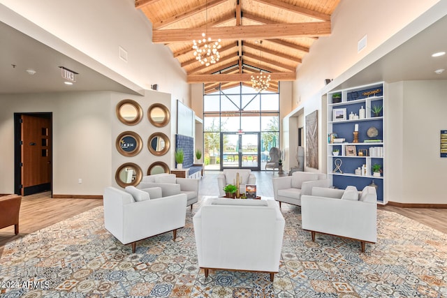 living room featuring wood ceiling, an inviting chandelier, high vaulted ceiling, beam ceiling, and light hardwood / wood-style flooring