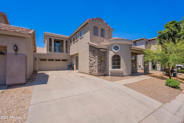 1244 S Tacoma, Mesa, AZ 85209 - mediterranean / spanish home featuring a balcony, stucco siding, a garage, and driveway