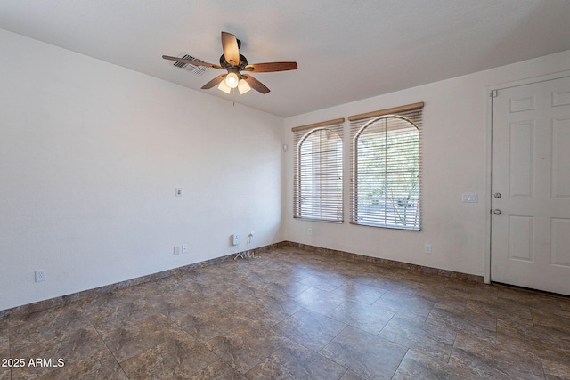 1244 S Tacoma, Mesa, AZ 85209 - spare room with a ceiling fan, baseboards, and stone finish flooring