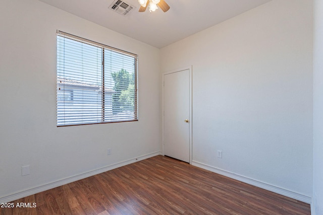 1244 S Tacoma, Mesa, AZ 85209 - unfurnished room featuring dark wood-style floors, ceiling fan, and baseboards