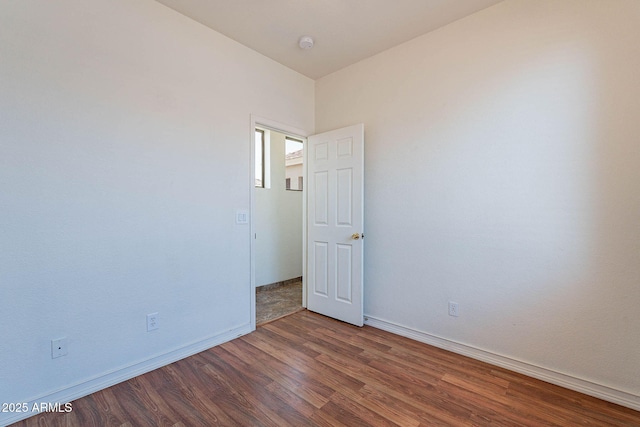 1244 S Tacoma, Mesa, AZ 85209 - unfurnished room featuring wood finished floors, baseboards, and a smoke detector