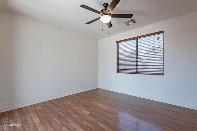 1244 S Tacoma, Mesa, AZ 85209 - empty room featuring dark wood-style floors, a ceiling fan, and baseboards