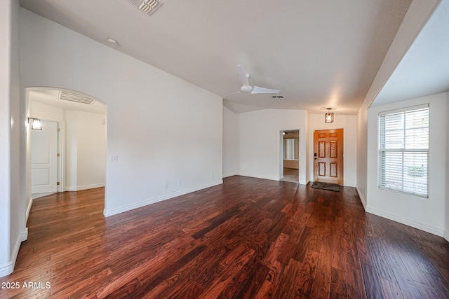 unfurnished living room featuring ceiling fan and dark hardwood / wood-style flooring