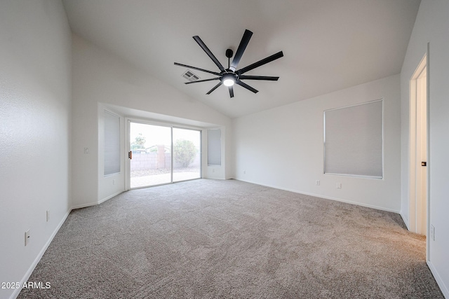 carpeted empty room with high vaulted ceiling and ceiling fan