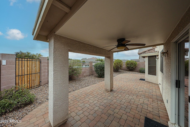 view of patio featuring ceiling fan