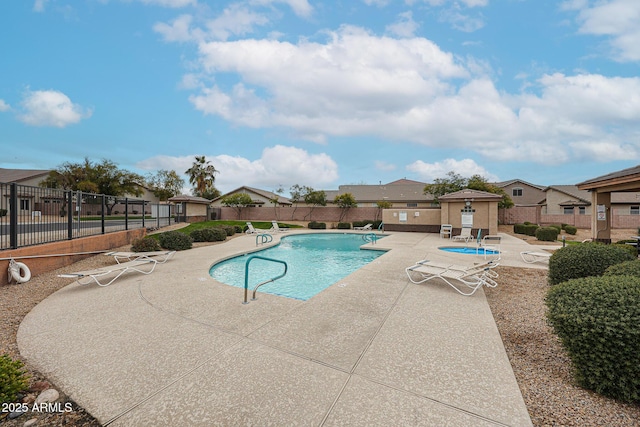 view of swimming pool with a patio area