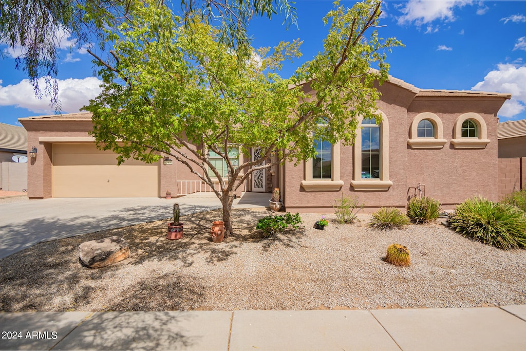 view of front of property with a garage