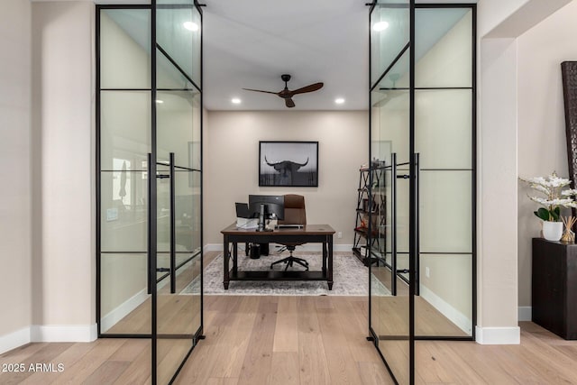 office space featuring hardwood / wood-style floors, ceiling fan, baseboards, and recessed lighting