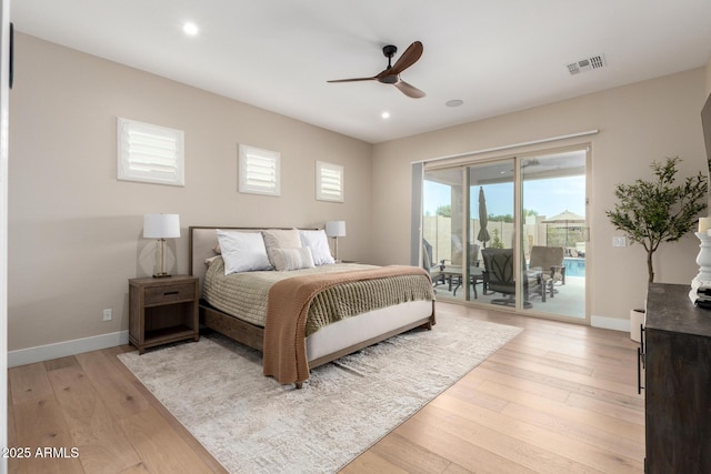 bedroom featuring baseboards, visible vents, light wood-type flooring, and access to outside