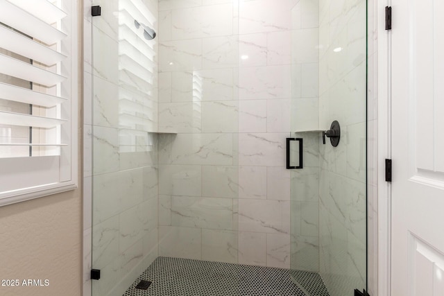 full bath featuring a shower stall