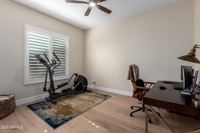 office with a ceiling fan, baseboards, and wood finished floors