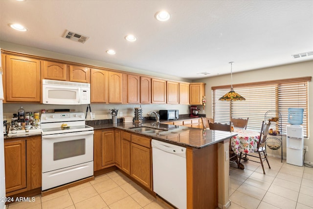 kitchen with sink, hanging light fixtures, kitchen peninsula, white appliances, and light tile patterned floors