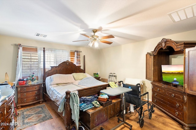 bedroom featuring ceiling fan and wood-type flooring