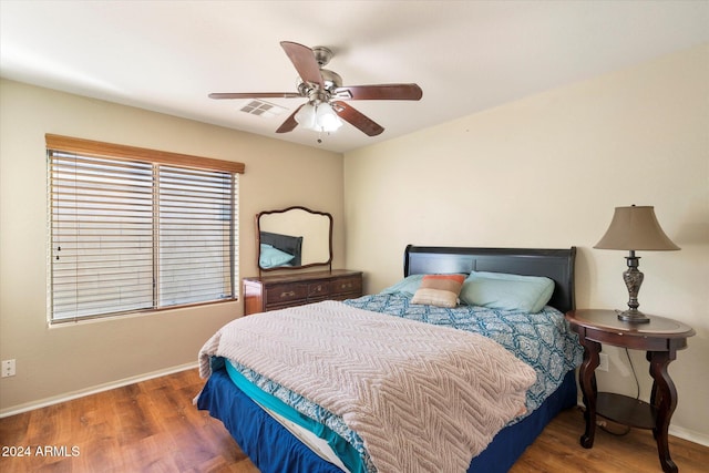 bedroom featuring ceiling fan and dark hardwood / wood-style flooring