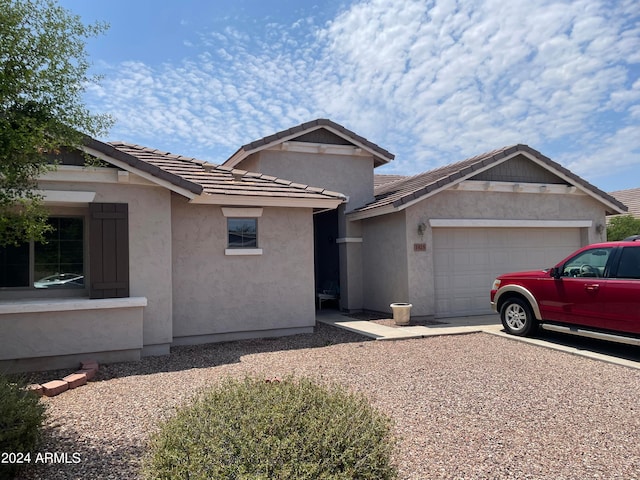 view of front of property with a garage