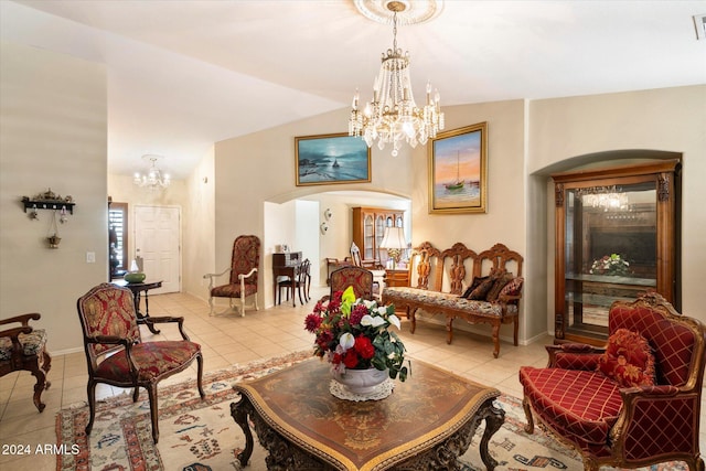 living room featuring light tile patterned flooring, vaulted ceiling, and an inviting chandelier