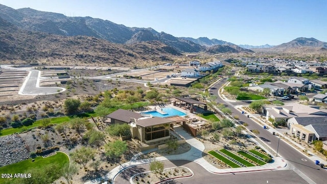 birds eye view of property with a mountain view