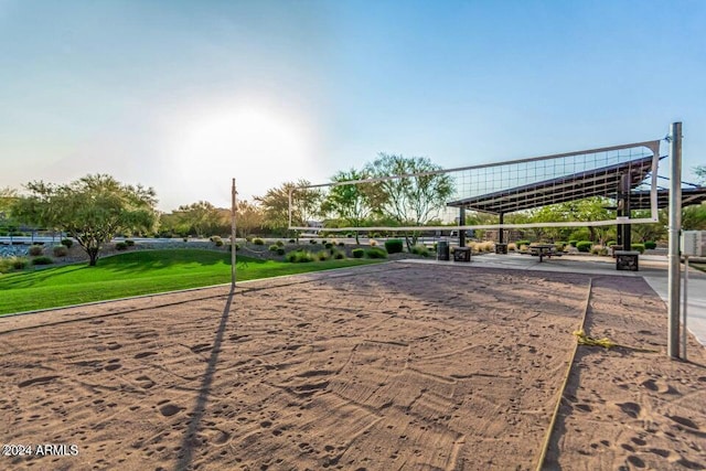 view of property's community featuring a yard and volleyball court