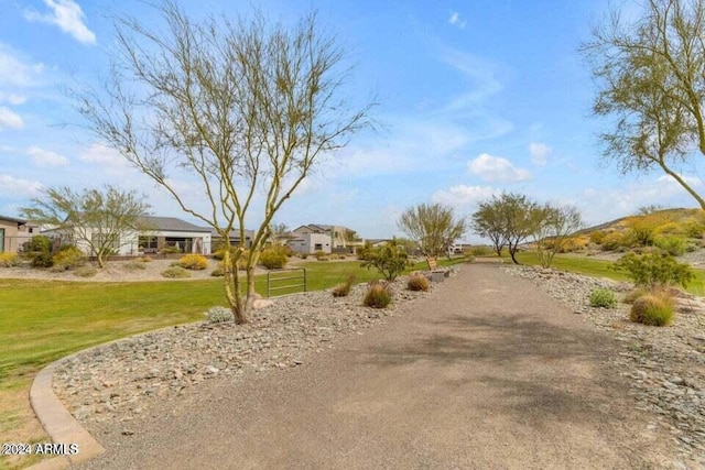 view of property's community featuring a lawn