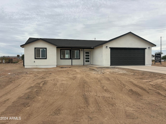 single story home featuring a garage