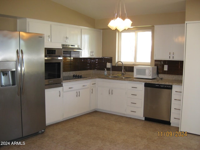 kitchen with white cabinets, appliances with stainless steel finishes, hanging light fixtures, and sink