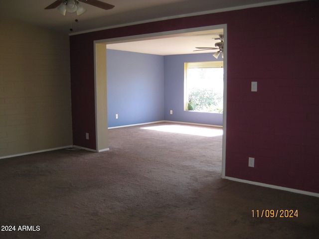 carpeted empty room with ceiling fan