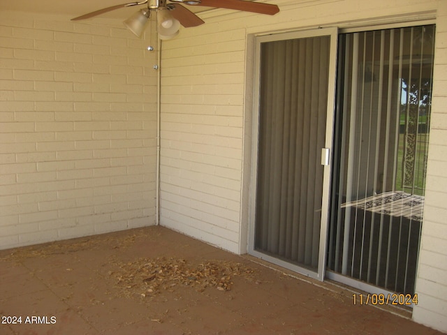 exterior space featuring ceiling fan