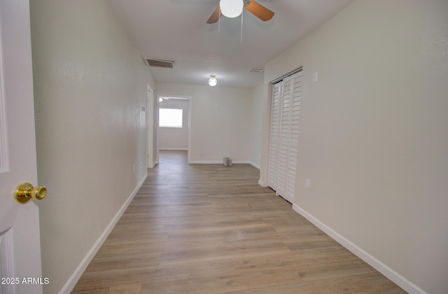 418 E 5th St, Eloy, AZ 85131 - hall featuring light wood-style floors and baseboards