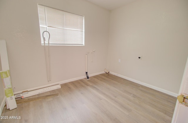 418 E 5th St, Eloy, AZ 85131 - empty room with light wood-type flooring and baseboards