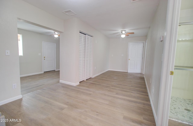418 E 5th St, Eloy, AZ 85131 - unfurnished room with a ceiling fan, light wood-style flooring, and baseboards