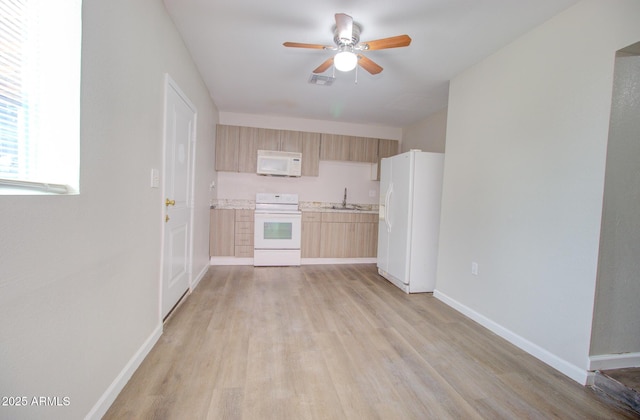 418 E 5th St, Eloy, AZ 85131 - kitchen featuring white appliances, light brown cabinetry, ceiling fan, light wood-style flooring, and light countertops