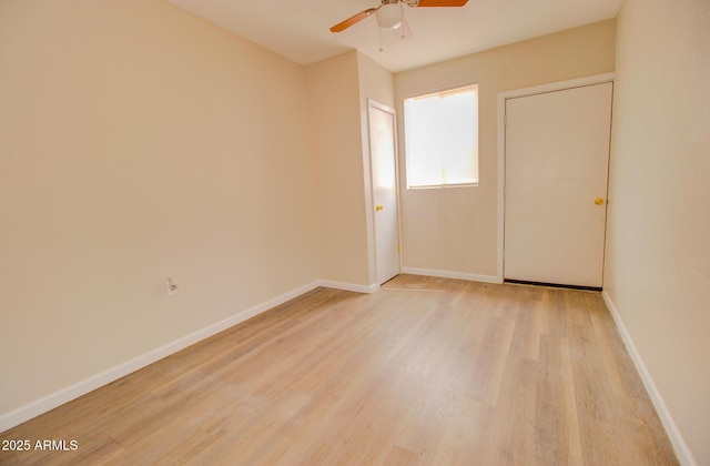 418 E 5th St, Eloy, AZ 85131 - spare room with a ceiling fan, light wood-type flooring, and baseboards
