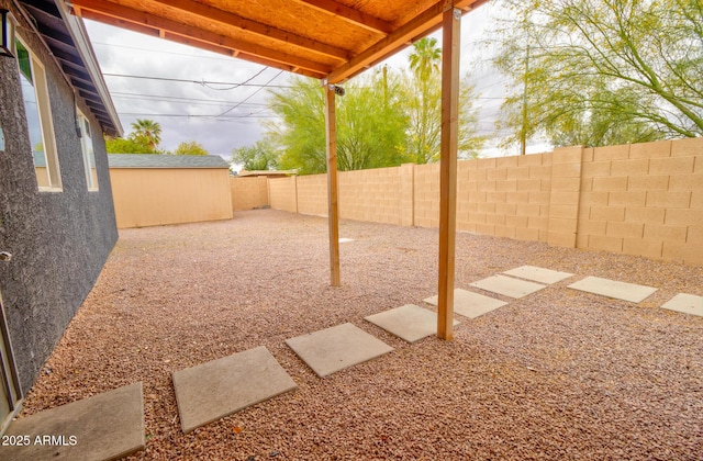 418 E 5th St, Eloy, AZ 85131 - fenced backyard with a patio area