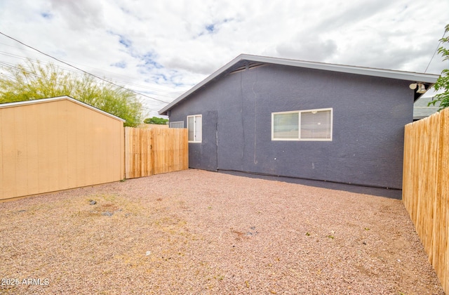 418 E 5th St, Eloy, AZ 85131 - view of property exterior featuring fence and stucco siding