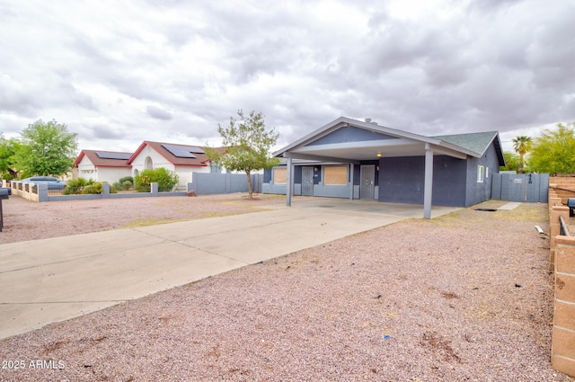 418 E 5th St, Eloy, AZ 85131 - ranch-style home featuring driveway, a carport, and stucco siding