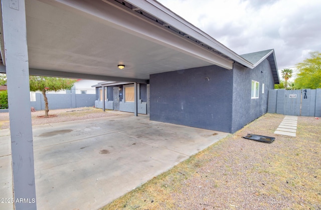 418 E 5th St, Eloy, AZ 85131 - view of patio featuring fence and a carport