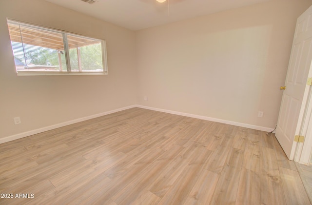 418 E 5th St, Eloy, AZ 85131 - unfurnished room featuring light wood finished floors and baseboards