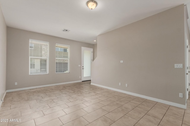 2000 N 36th St Unit 14, Phoenix, AZ 85008 - unfurnished room with baseboards and light tile patterned floors