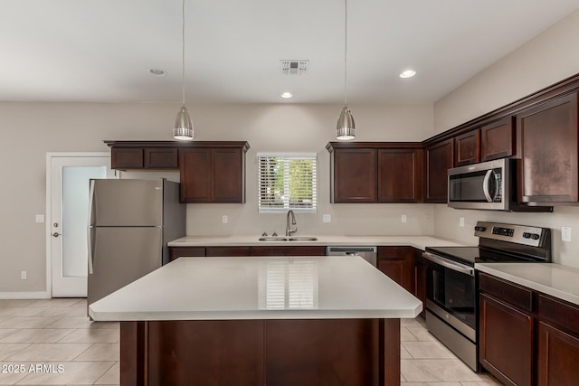 2000 N 36th St Unit 14, Phoenix, AZ 85008 - kitchen featuring appliances with stainless steel finishes, light tile patterned floors, light countertops, and recessed lighting