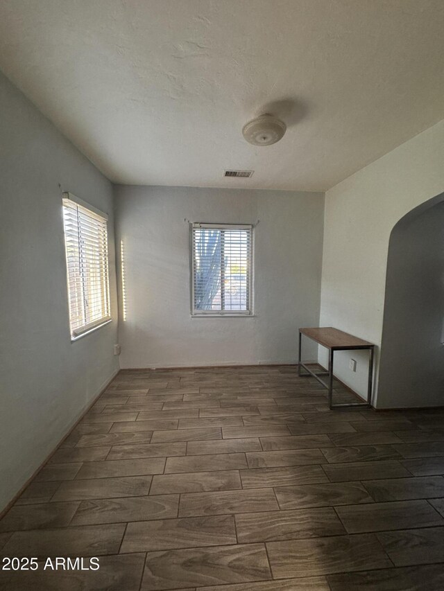 418 N 14th St, Phoenix, AZ 85006 - spare room with wood tiled floors and arched walkways