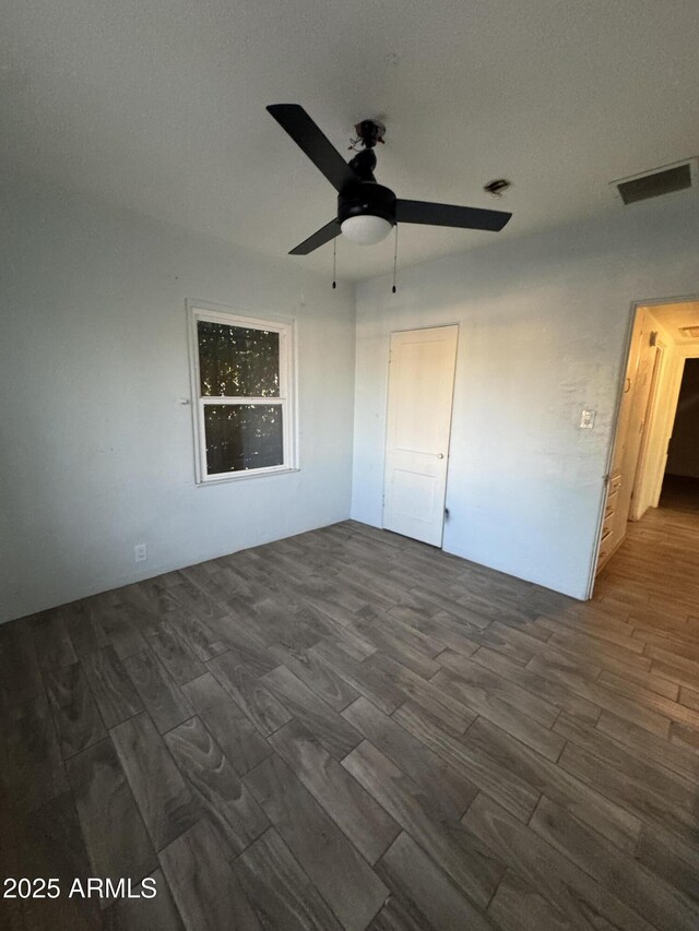 418 N 14th St, Phoenix, AZ 85006 - unfurnished bedroom with dark wood finished floors and ceiling fan