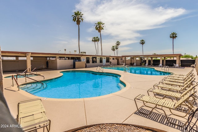 view of swimming pool featuring a patio