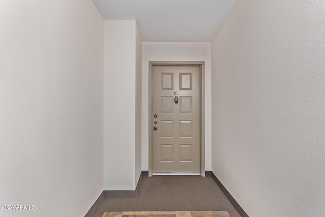 doorway to outside featuring dark hardwood / wood-style floors