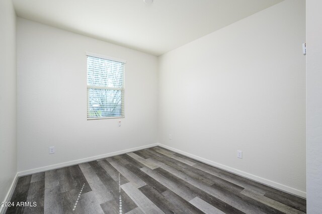 12568 W Orangewood Ave, Glendale, AZ 85307 - empty room featuring baseboards and wood finished floors