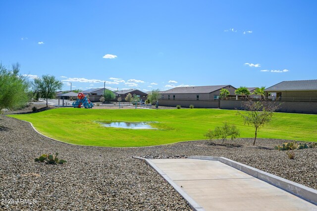 12568 W Orangewood Ave, Glendale, AZ 85307 - view of yard with a water view, fence, and a residential view